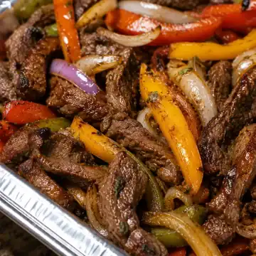 Act as an expert Food Blogger and SEO Specialist writing for a premium food blog (Allwecook). I need you to write a brand-new, highly engaging, and SEO-optimized recipe post for [Spicy Steak Fajitas ]. Here is the raw data for the recipe: Ingredients: > [2 pounds sirloin steak, cut into thin strips 1 red bell pepper thinly sliced 1 yellow bell pepper thinly sliced 1 green bell pepper thinly sliced 1 large yellow onion, thinly sliced 1 tablespoon lime juice ½ teaspoon chili powder ⅛ teaspoon cayenne pepper 2 minced garlic cloves 2 cups Mexican blend cheese, grated 6 to 8 tortillas ] Instructions: > [In a zip lock bag, place the sliced steak, spices, lime juice and olive oil Seal bag, shake to coat steak pieces Add the peppers and onions to the bag and close the bag Shake the bag again to coat the vegetables Add 1 tablespoon of olive oil to a skillet and add the ingredients from the bag to the heated skillet. Cook until the vegetables are just tender and the steak is done. Serve with warm tortillas, sprinkle with grated cheese and your choice of optional toppings ] Your Main Goals: Maximize Ad Real Estate (High RPM): Use extremely short paragraphs (strictly 1 to 2 sentences maximum per paragraph) to allow ad scripts to inject banners naturally. Boost SEO: Use natural LSI keywords and organize the content with clear H2 and H3 tags. Zero Fluff: Aim for 700-1300 words in the main body by providing ACTUAL value, culinary science, and helpful tips, not personal stories. CRUCIAL RULE: Do NOT write the step-by-step cooking instructions or the exact ingredient list with measurements in the main body text. Save them EXCLUSIVELY for the "Recipe Card" section at the very end. Required Content Structure (Please follow exactly): [Part 1: The Main Blog Post] Catchy Introduction: Welcome to Allwecook! Write a strong hook explaining why this dish is amazing, who it's for, and when to serve it. [H2] Why This Recipe Works: Explain the flavor profile, textures, and why the cooking method makes it successful. [H2] Key Ingredient Notes: Discuss 3-4 main ingredients and why they are important (NO exact measurements here). [H2] Easy Substitutions & Variations: Provide options for missing ingredients or dietary swaps. [H2] Pro Tips for Success: Give 3 actionable tips (based on my provided instructions) to ensure the reader gets perfect results. [H2] Storage and Reheating: How long does it last? Fridge/freezer instructions, and the best way to reheat it without ruining the texture. [H2] Frequently Asked Questions (FAQ): Create and answer 2-3 logical questions a reader might have about this specific recipe. [Part 2: The Recipe Card Format] (Output this section clearly separated at the end, formatted so I can easily copy/paste it into my WordPress recipe plugin) Recipe Title: > * Description: (A short 2-sentence summary) Ingredients List: (Format cleanly with exact measurements based on my input) Step-by-Step Instructions: (Format cleanly as numbered steps based on my input) Recipe Notes: (Add one final pro-tip for the recipe card)